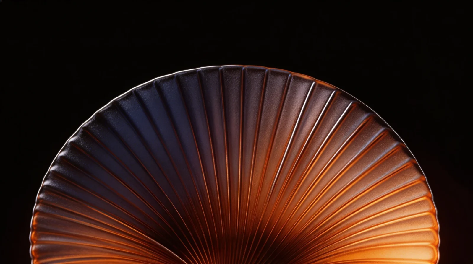Ribbed glass fan in violet and amber on black