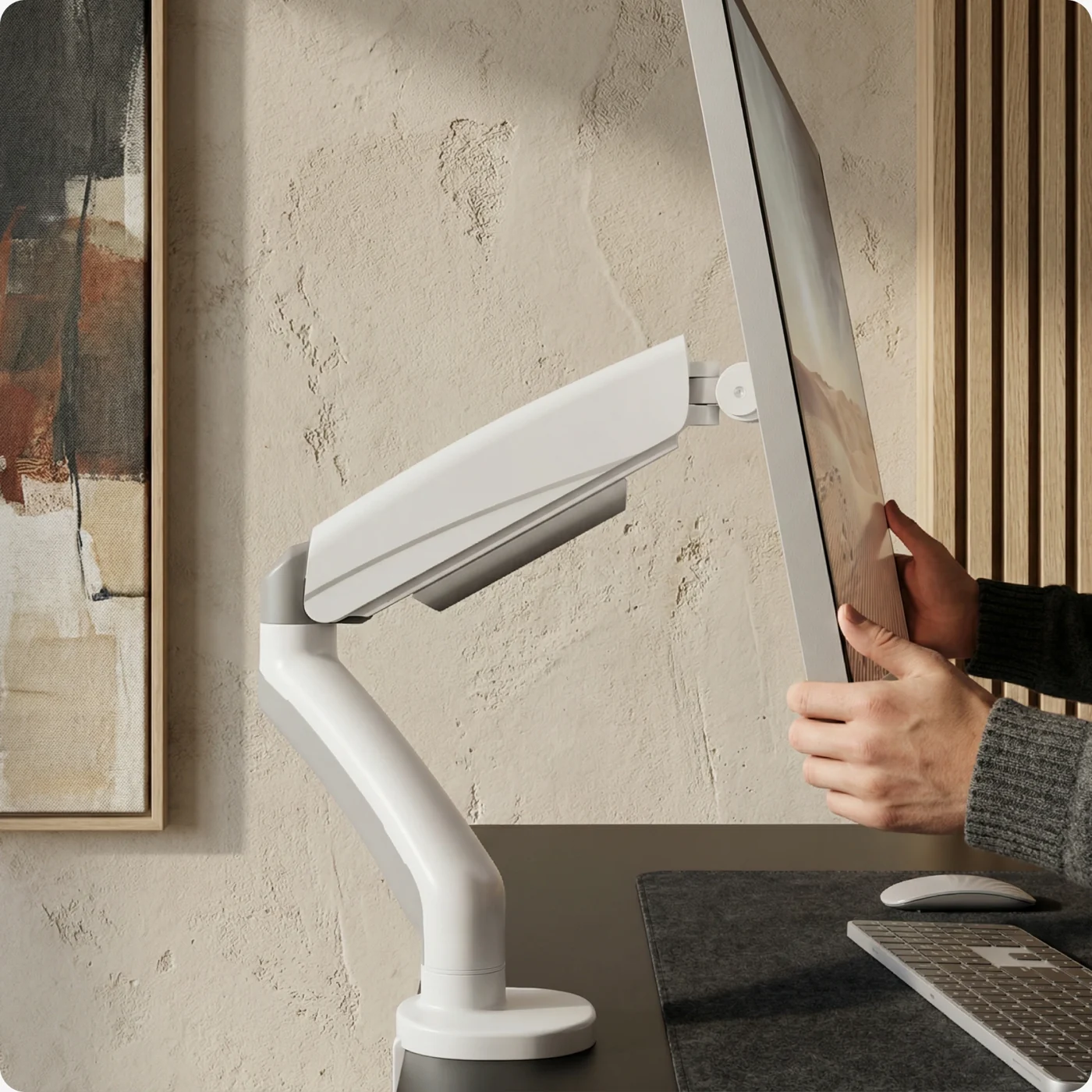 Monitor arm tilting a screen