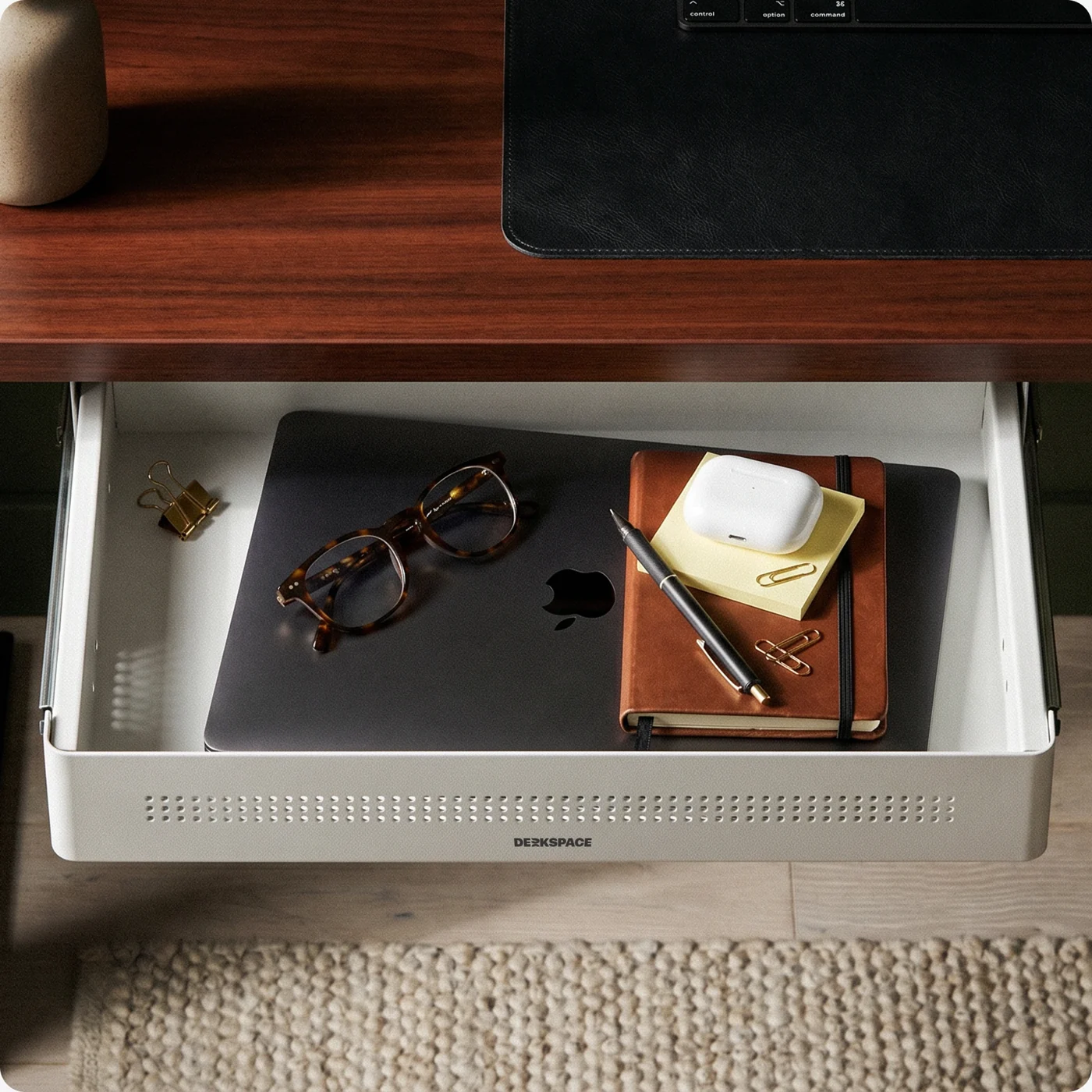 Drawer open with notebook and glasses