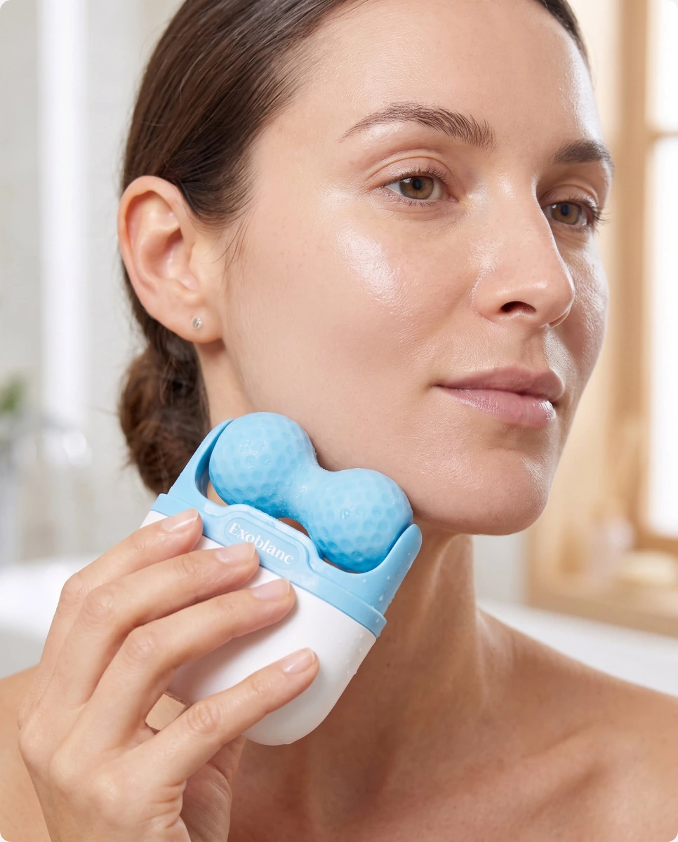 Woman using the cooling roller on her cheek